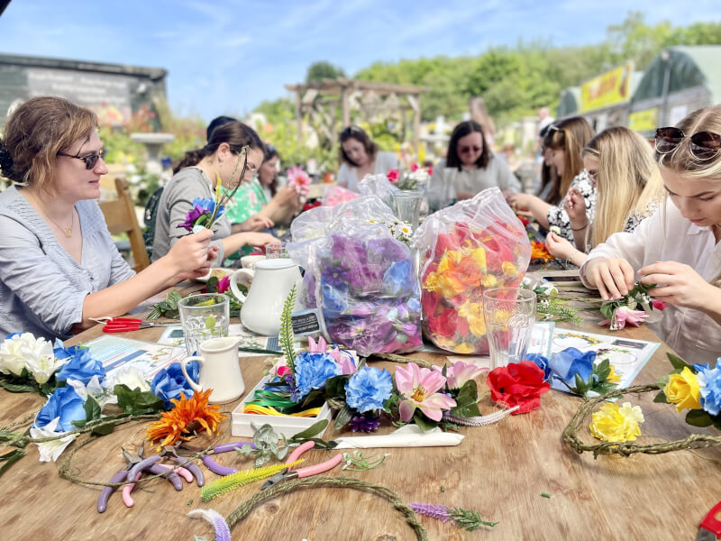 A group of women are at a floristry workshop hosted by The Crafty Hen